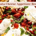 Creamy burrata cheese served with marinated cherry tomatoes, fresh basil, and toasted baguette slices.